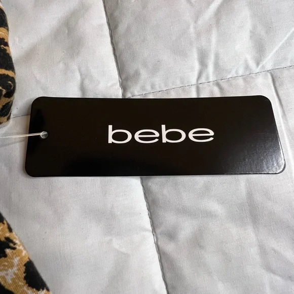 NWT Bebe fitted cut out shoulder crew neck top. Women’s S. Rhinestone design - Picture 7 of 7